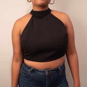 Black sleeveless turtleneck cropped top